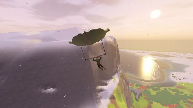 Gliding past a sea cliff with the sun low over the water